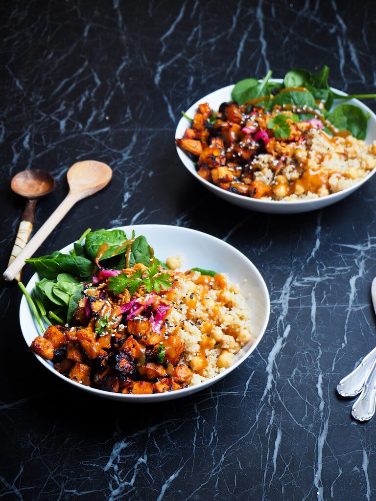front view of two miso sweet potato and quinoa bowls
